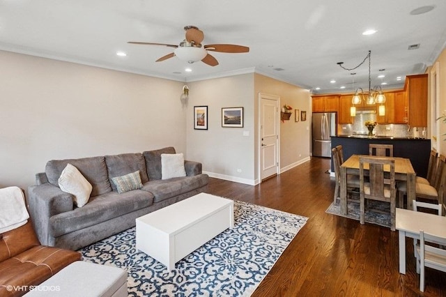 living room with a ceiling fan, recessed lighting, baseboards, ornamental molding, and dark wood-style floors