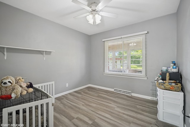 4363 W Kennedy Dr, Gurnee, IL 60031 - unfurnished bedroom featuring wood finished floors and a ceiling fan