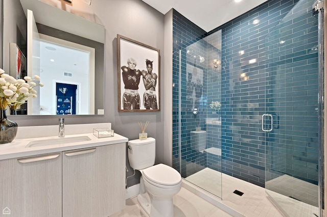 full bath with a shower stall, vanity, toilet, tile patterned flooring, and visible vents
