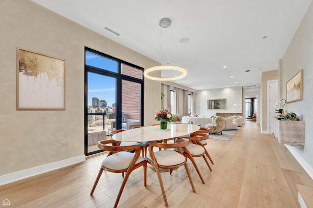 305 S Racine Ave Ph-A, Ph-A Chicago, IL 60607 - dining room with light wood-type flooring and baseboards