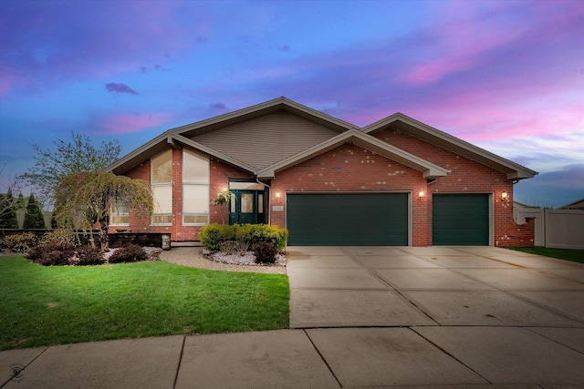 ranch-style house with driveway, a lawn, a garage, brick siding, and fence