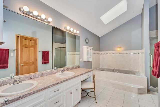 full bathroom featuring a sink, tile patterned flooring, a shower stall, and a bath