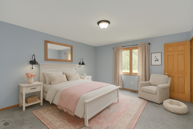 bedroom featuring baseboards and light carpet