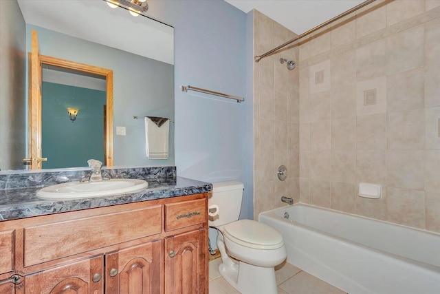 full bathroom with tile patterned floors, vanity, toilet, and  shower combination