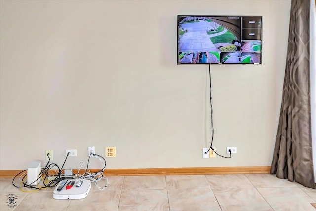 unfurnished room featuring baseboards