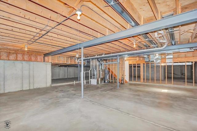 unfinished below grade area featuring water heater