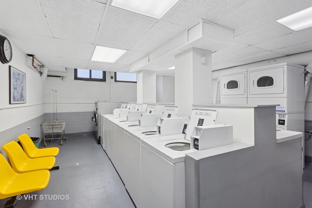 community laundry room with separate washer and dryer and stacked washer / dryer