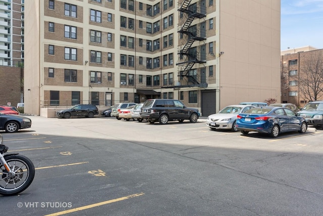 view of property with uncovered parking