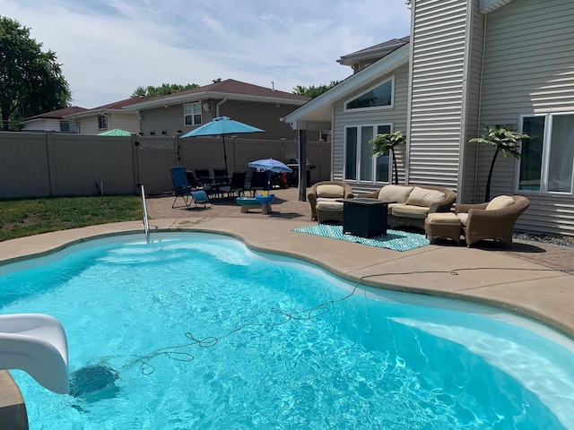 16725 92nd Ave, Orland Hills, IL 60487 - view of swimming pool with a water slide, a patio, outdoor lounge area, and fence