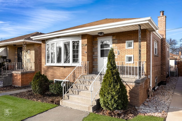6330 W 64th Pl, Chicago, IL 60638 - bungalow-style house featuring a chimney and brick siding