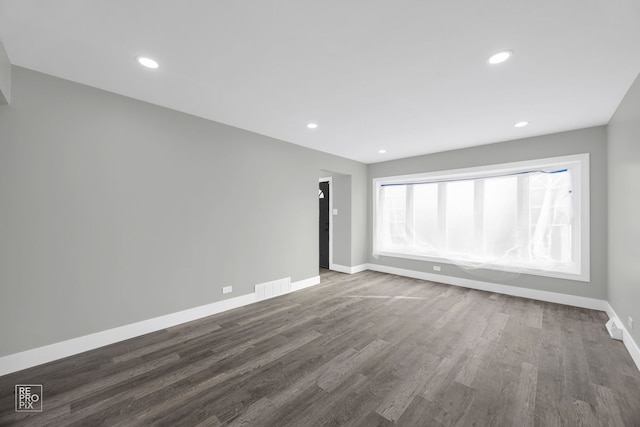 6330 W 64th Pl, Chicago, IL 60638 - unfurnished room featuring baseboards, dark wood-style flooring, and recessed lighting