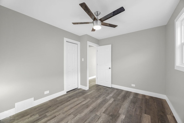 6330 W 64th Pl, Chicago, IL 60638 - unfurnished bedroom with wood finished floors, visible vents, a closet, baseboards, and ceiling fan