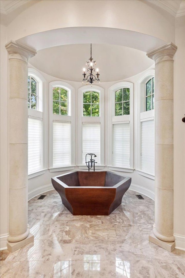 full bath featuring a healthy amount of sunlight, marble finish floor, and ornate columns