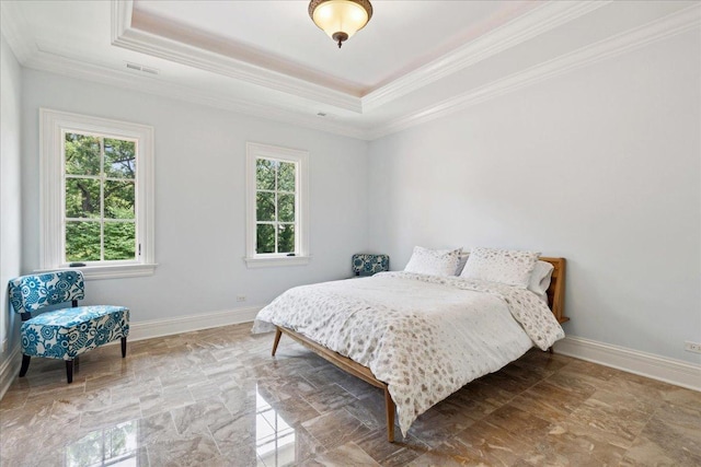 bedroom featuring a raised ceiling, visible vents, crown molding, and baseboards