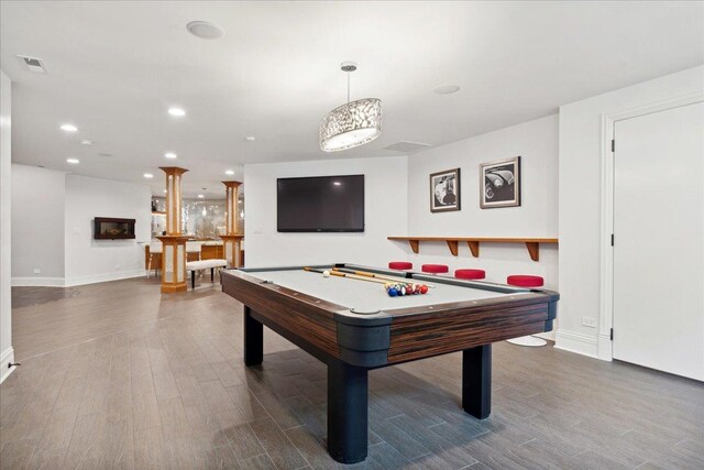 recreation room with visible vents, wood finished floors, baseboards, and billiards