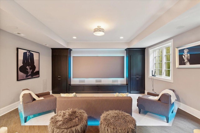 cinema room featuring baseboards, wood finished floors, visible vents, and recessed lighting