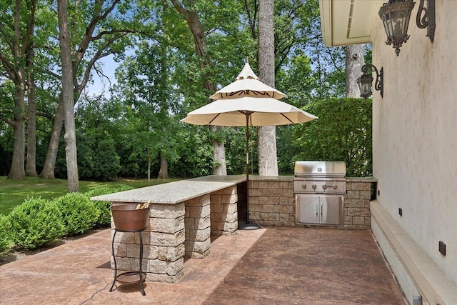 view of patio with a grill and area for grilling