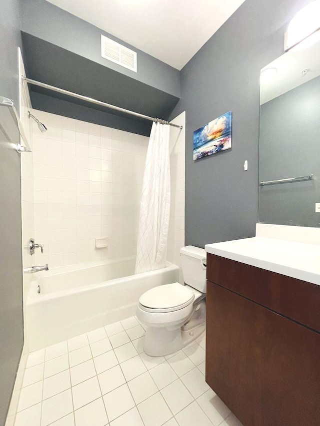 bathroom with tile patterned floors, shower / bathtub combination with curtain, toilet, and vanity