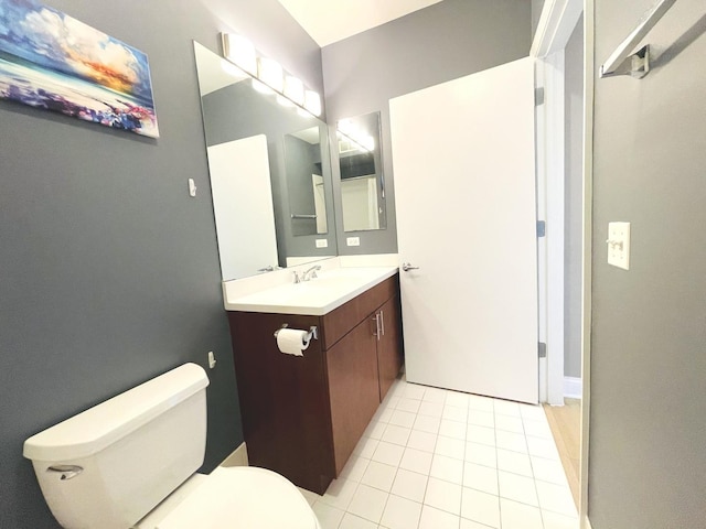 bathroom featuring vanity, toilet, and tile patterned floors