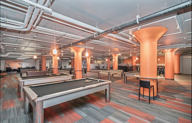 recreation room with decorative columns, pool table, and carpet flooring