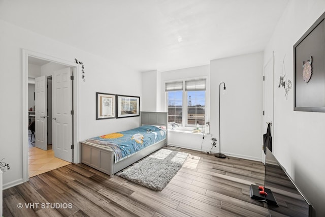 bedroom featuring wood finished floors