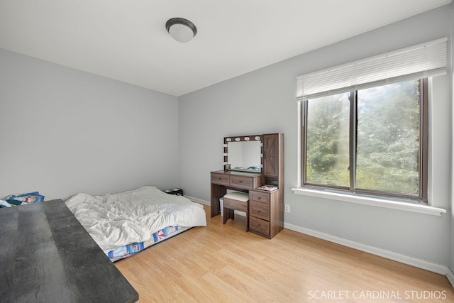 516 Gardiner Ct, Romeoville, IL 60446 - bedroom featuring light wood-style flooring and baseboards