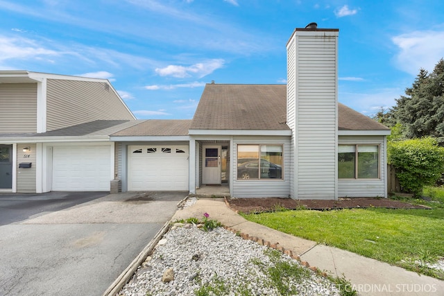 516 Gardiner Ct, Romeoville, IL 60446 - mid-century modern home with a garage, asphalt driveway, a chimney, a front lawn, and a shingled roof