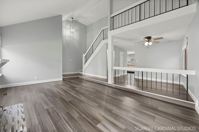 516 Gardiner Ct, Romeoville, IL 60446 - unfurnished living room featuring baseboards, wood finished floors, ceiling fan, and high vaulted ceiling
