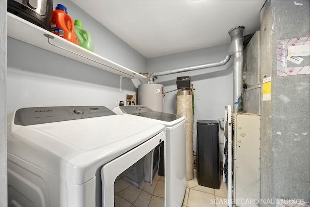 516 Gardiner Ct, Romeoville, IL 60446 - washroom featuring separate washer and dryer, water heater, light tile patterned floors, and heating unit