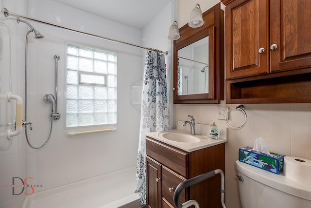 full bathroom with vanity, toilet, and curtained shower