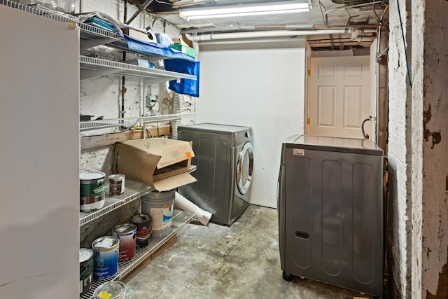 clothes washing area featuring washer and dryer
