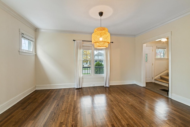 unfurnished dining area featuring stairs, wood finished floors, baseboards, and ornamental molding