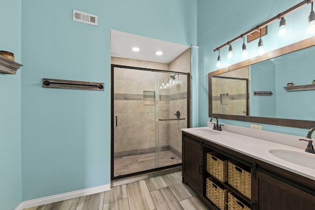 1844 Candlelight Cir, Montgomery, IL 60538 - full bath featuring a stall shower, double vanity, and wood finished floors