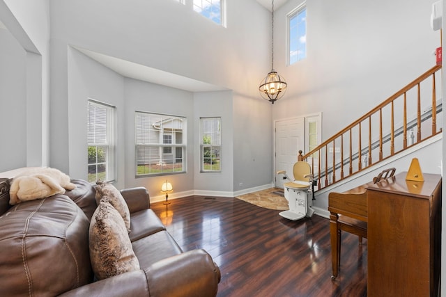 1844 Candlelight Cir, Montgomery, IL 60538 - living room featuring stairway, healthy amount of natural light, wood finished floors, and a high ceiling