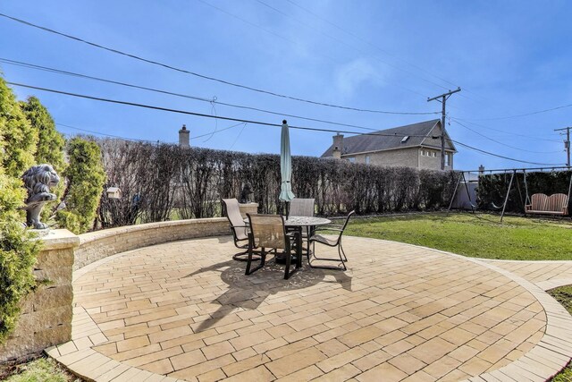 view of patio / terrace with outdoor dining space and a fenced backyard