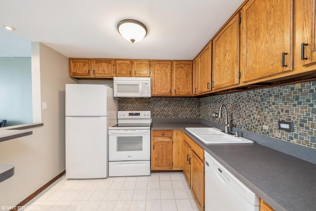 2005 S Finley Rd Unit 611, Lombard, IL 60148 - kitchen featuring white appliances, a sink, brown cabinets, tasteful backsplash, and light tile patterned floors