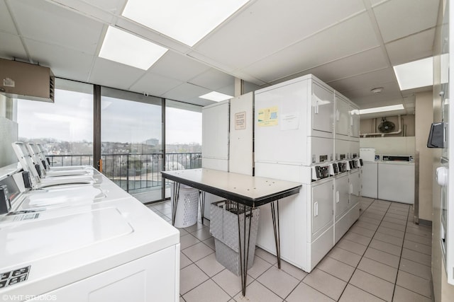 2005 S Finley Rd Unit 611, Lombard, IL 60148 - communal laundry room with stacked washing machine and dryer, light tile patterned floors, and separate washer and dryer