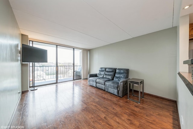 2005 S Finley Rd Unit 611, Lombard, IL 60148 - living room featuring wood finished floors, a wall of windows, and baseboards