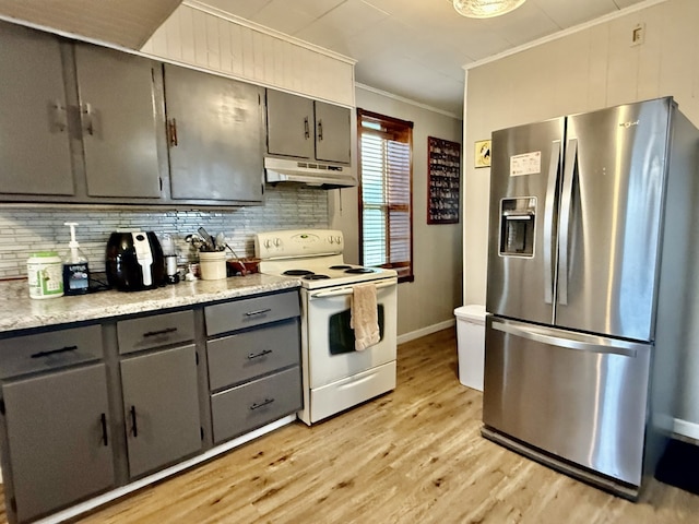 kitchen with under cabinet range hood, gray cabinets, stainless steel fridge with ice dispenser, white electric range, and ornamental molding