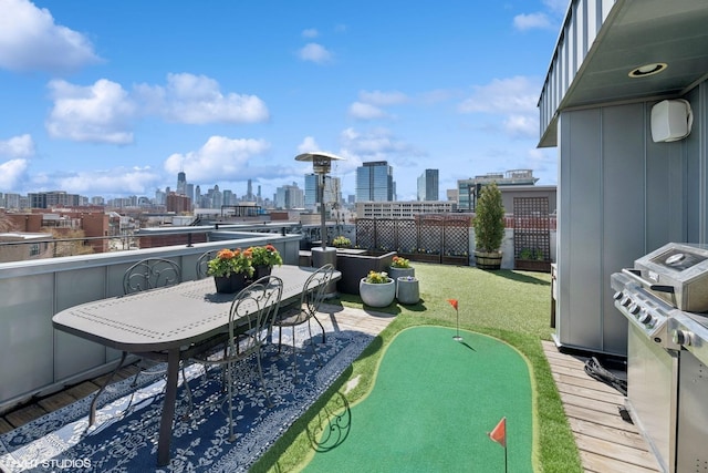 exterior space with a city view and a grill