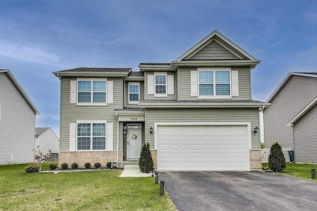 view of front of home featuring brick siding, driveway, a front lawn, and a garage