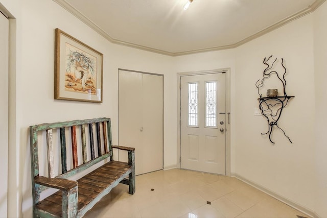 entryway with light tile patterned floors, baseboards, and ornamental molding