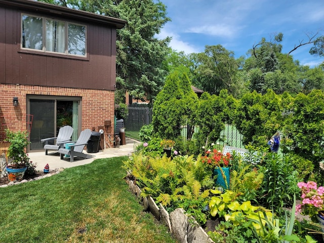 view of yard featuring a patio and fence