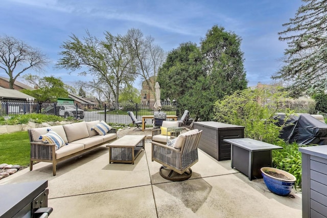 view of patio with fence, an outdoor living space, and a grill