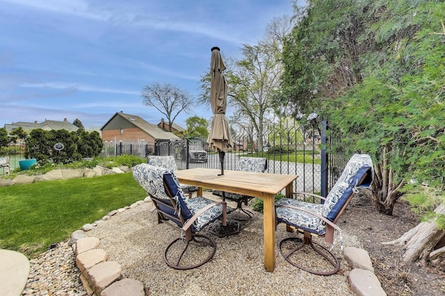 view of patio / terrace featuring fence and outdoor dining area