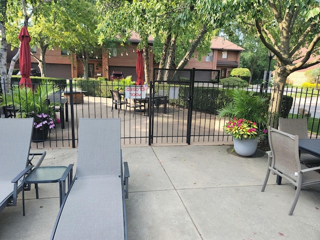 view of patio / terrace featuring fence