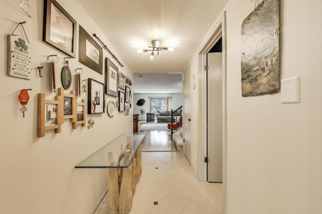 corridor with light tile patterned floors