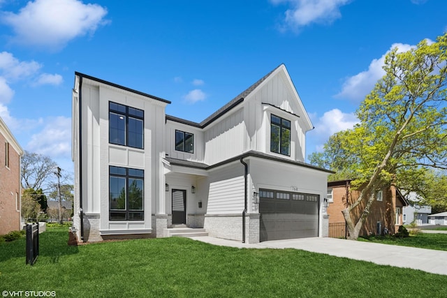 view of front of home featuring board and batten siding, an attached garage, a front yard, and concrete driveway
