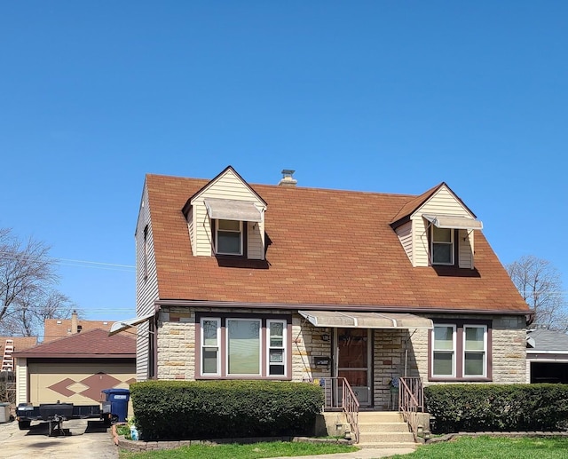 128 Whitehall Ave, Northlake, IL 60164 - new england style home featuring roof with shingles and stone siding