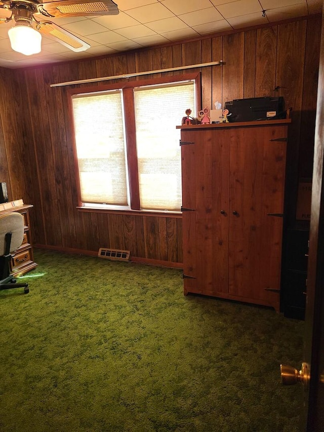 128 Whitehall Ave, Northlake, IL 60164 - empty room featuring wood walls, a healthy amount of sunlight, and visible vents